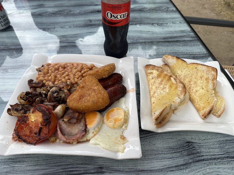 Full English breakfast on a white plate